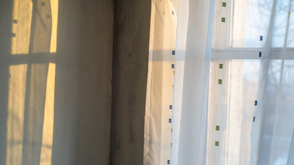 the window casts a shadow on the wall