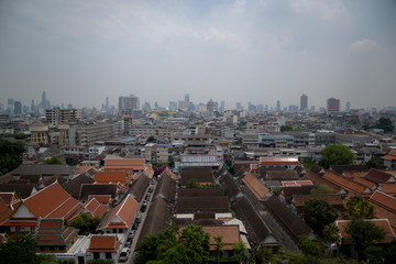 Obraz premium The view of Bangkok city during daylight from Golden mountain temple top.