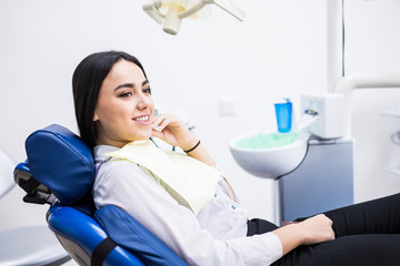 Overview of dental caries prevention. Woman at the dentist's chair during a dental procedure....