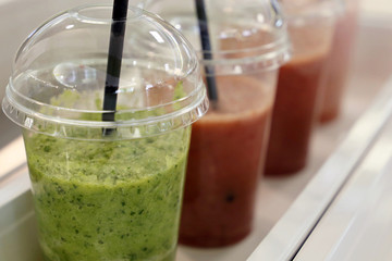 Detox cocktails in a row, fresh vitamin drinks from berries and vegetables