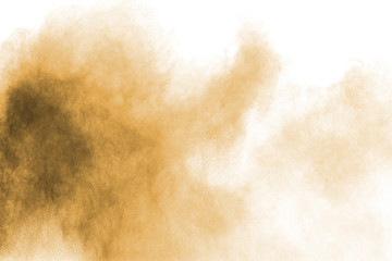 Brown dust cloud.Brown particles splattered on white background.