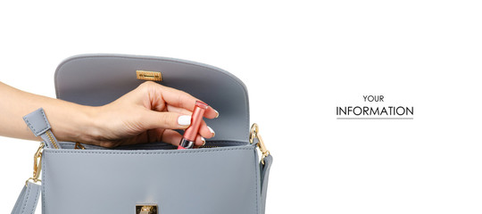 A hand put cosmetic lipstick lip gloss in the female blue gray leather bag pattern on a white...