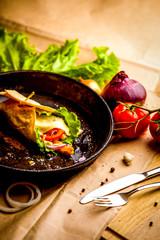 food composition on black cast-iron pan