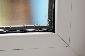 white window. there is condensation on it. close-up