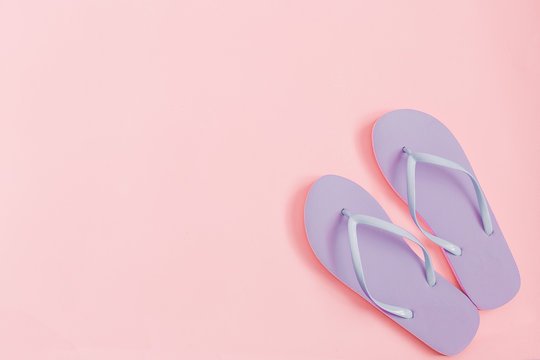 Flip flops on pink background