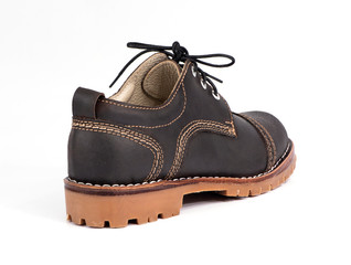 Men brown shoe isolated on a white background. Fashion advertising shoe photo.