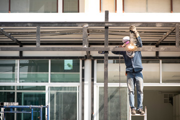 Craftsmen  is welding metal steel. To install the steel structure.