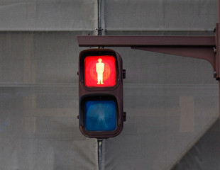 Traffic lights for pedestrian showing the red