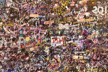 Notes in different languages on the wall of Juliet's house in Verona, Italy