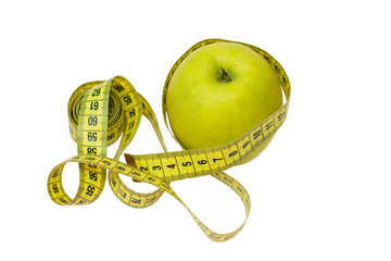 Apple and measuring tape on a white background, isolate. Diet, proper nutrition