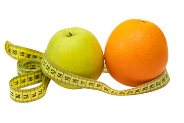 Orange, apple and measuring tape on a white background, isolate. Diet, proper nutrition