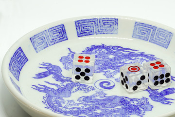 nine point dice in bowl on white background
