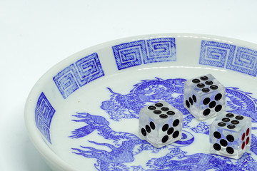 twenty foul point dice in bowl on white background