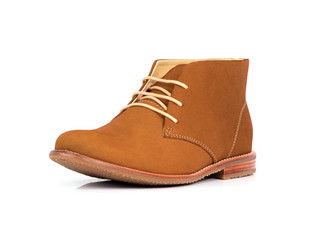 Men’s brown ankle boots with nubuck leather isolated on a white background.