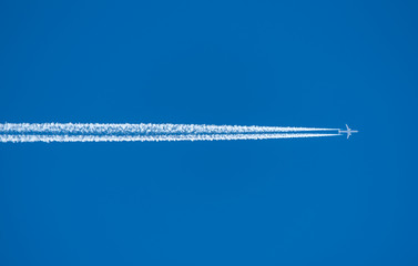 airplane in the sky with white trail