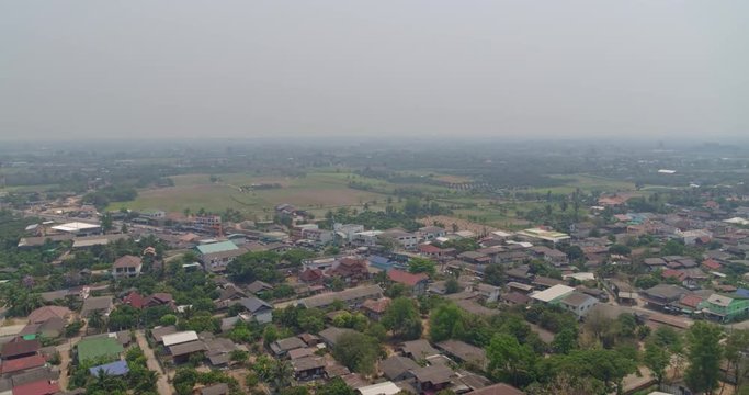 Ban Kad Thailand Aerial v1 Flying over small rural town, houses and fields - March 2018