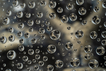 Water Droplets on Glass with Skull Background