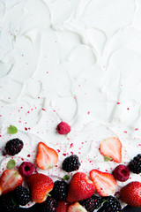 Fresh and Frozen Berries on Stylized Yogurt Surface