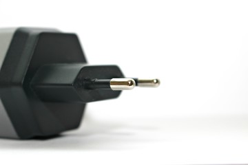 white background electronics appliances technology socket voltage current light black gray power two connection adapter plastic metal shadow gray stationery office modern