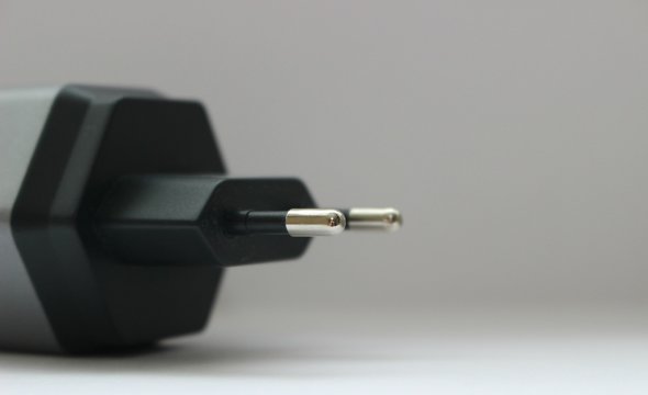 white background electronics appliances technology socket voltage current light black gray power two connection adapter plastic metal shadow gray stationery office modern