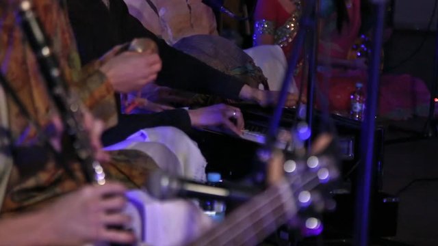 Group of Hare Krishna People Playing Traditional Indian Instruments Close-up..