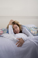 Obraz na płótnie Canvas Sick Woman in Bed