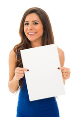 young woman holding sign business board. isolated portrait of casual dressed woman. 