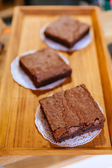 Square Brownie Chocolate Cakes on wooden tray that ready to sell. Melt in your mouth.