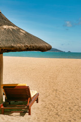 One lonely lounger on the deserted beach of Hainan Island. 