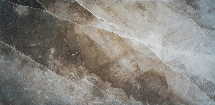 The texture of natural stone (granite, marble) on the floor of a large stoneware tile