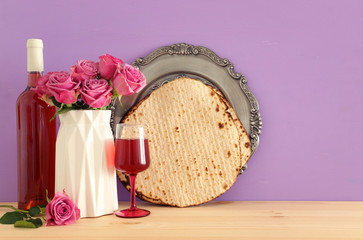 Pesah celebration concept (jewish Passover holiday) over wooden table
