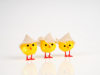 little baby toy chicken on a white background, a lot of chickens, the concept for Easter