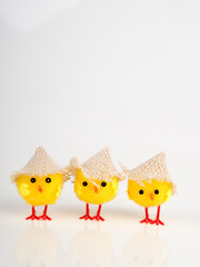 little baby toy chicken on a white background, a lot of chickens, the concept for Easter