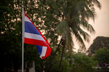 The blowing Thai flag at the sunset.