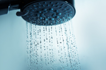 Naklejka na ściany i meble Shower head and water drops.