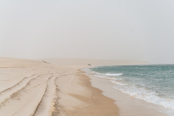 Qatari desert where water intersects with the sea