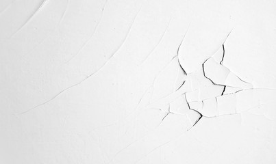 Black and white texture with exfoliated paint. Monochrome abstract grunge background. Сhaotic paint cracks. Flaking stucco. Clean old wall close-up