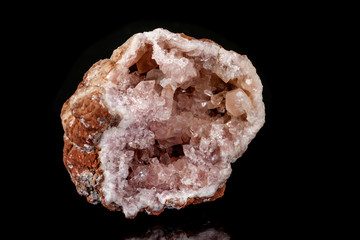 Macro mineral stone Pink Amethyst on a black background