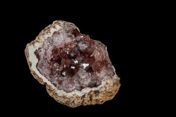 Macro mineral stone Pink Amethyst on a black background