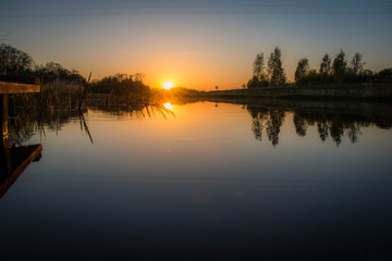 Fototapeta na wymiar River in the countriside during sunset