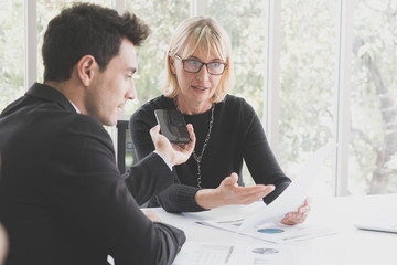 man is interviewing and recording sound the successful businesswomen and personal matters in the...
