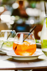 Aperol spritz and HUGO cocktail in misted glass, selective focus .