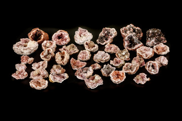 Macro mineral stone Pink Amethyst on a black background