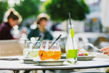 Aperol spritz and HUGO cocktail in misted glass, selective focus .