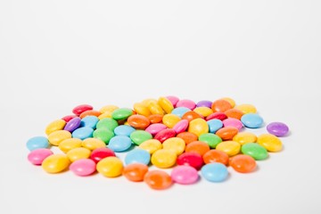 Pile of colorful sweets candies - side view.