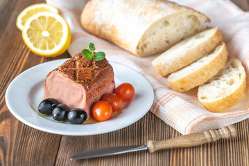 Chicken liver pate on the white plate