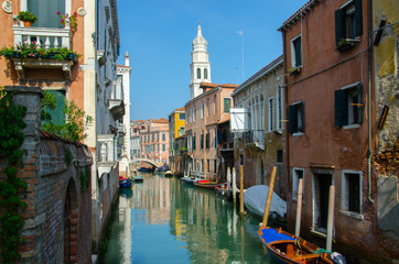 Obraz na płótnie Canvas The canal in Venice, sky reflection in water