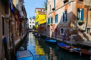 Fototapeta na wymiar The canal in Venice, sky reflection in water