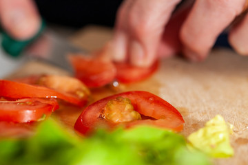 Woman cutting tomatoes