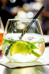 Aperol spritz and HUGO cocktail in misted glass, selective focus .